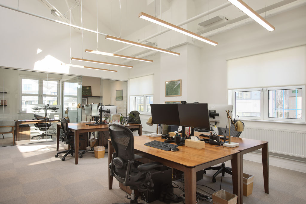 The London Office — Desks under linear lighting
